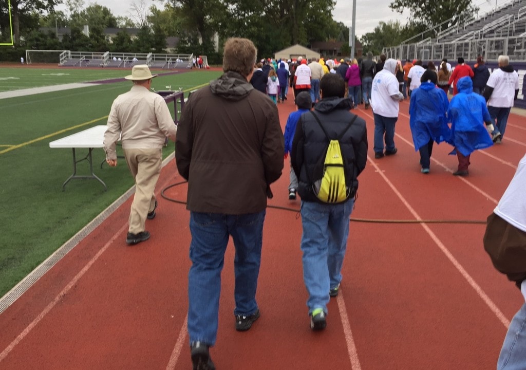 Supporters walking on track 