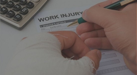 Injured person signing a work injury form